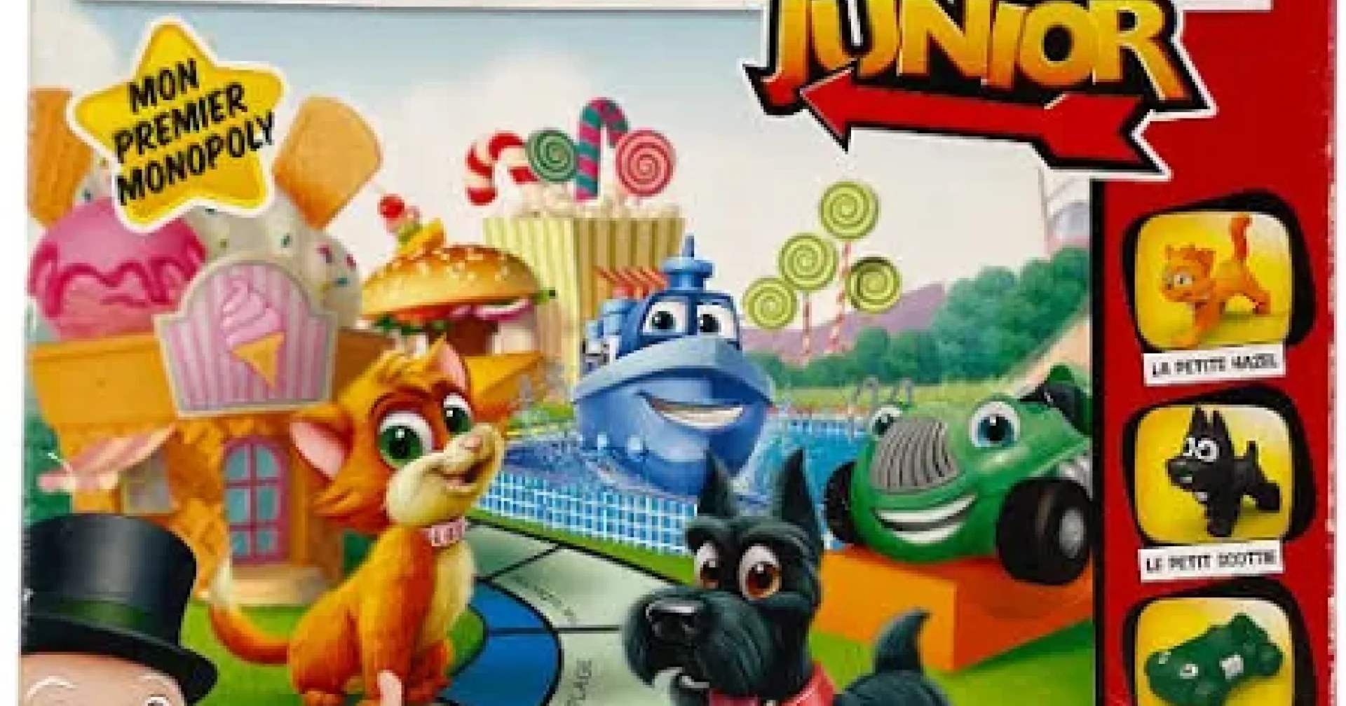 Plateau du Monopoly Junior installé sur une table avec pions et billets pour une partie en famille